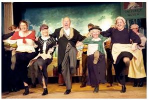David Proud centre as Alfred Dolittle